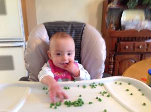 Lilli eating peas